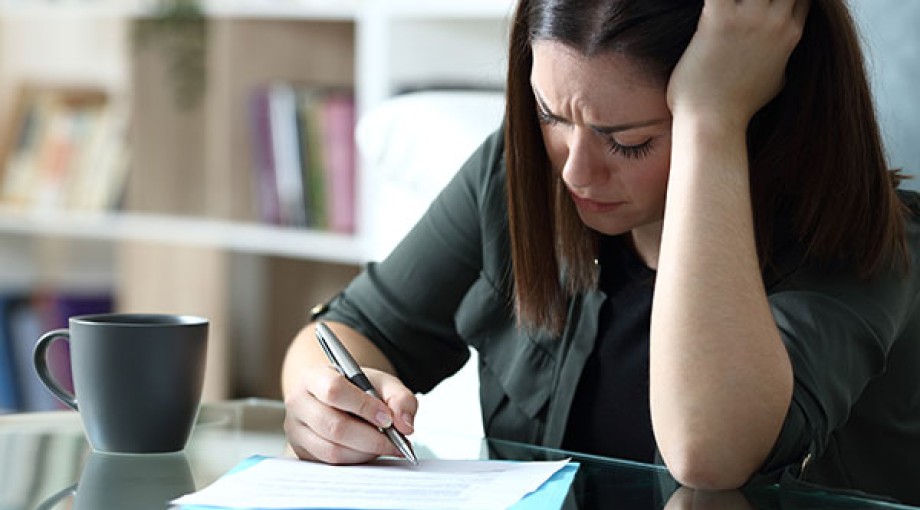Stressed woman filling out a petition