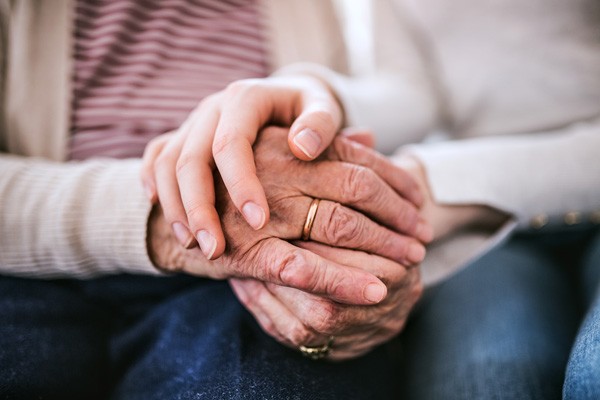 Senior couple holding hands