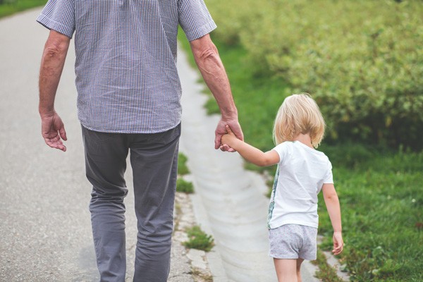Grandparent walking with granddaughter