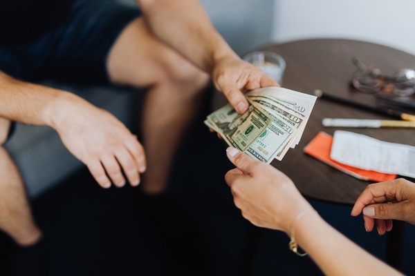 money being exchanged between two people