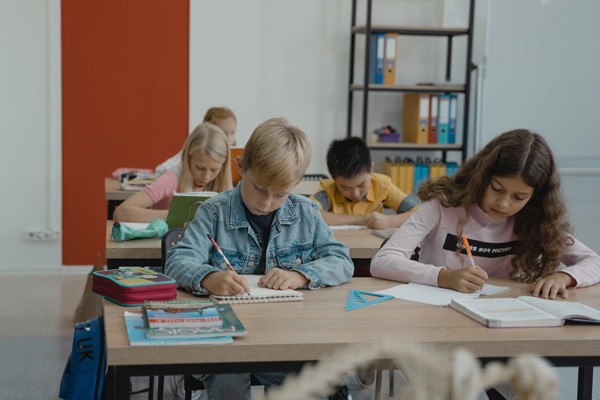 Grade school children in a classroom setting